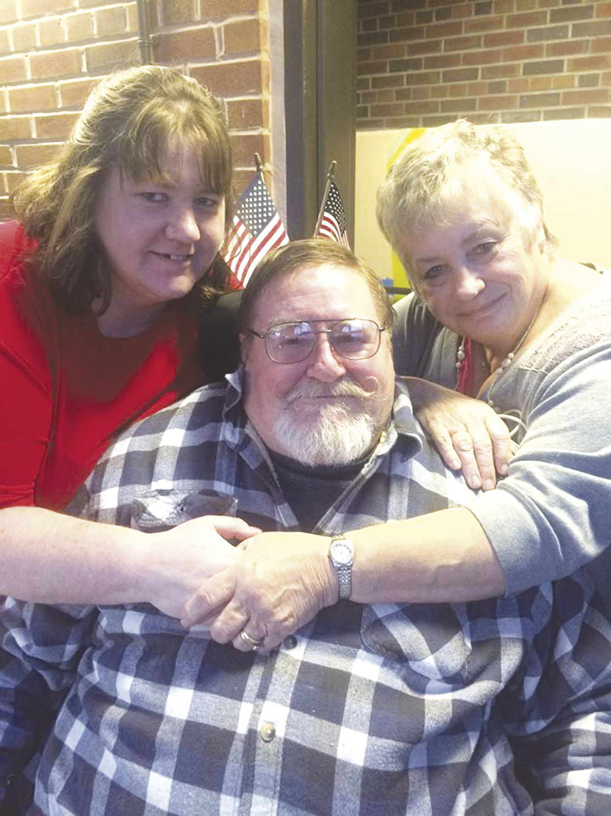 greg with wife and daughter.jpg